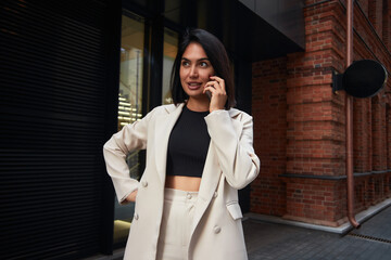 business woman in a suit works during rush hour. a young girl hurries to a meeting. young...