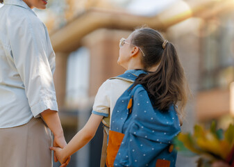 Parent and kid going to school