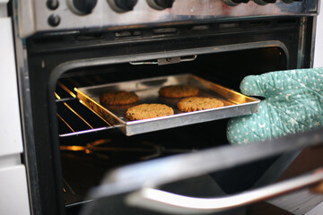 Hand Taking Cookies On Oven. Baked Cookies