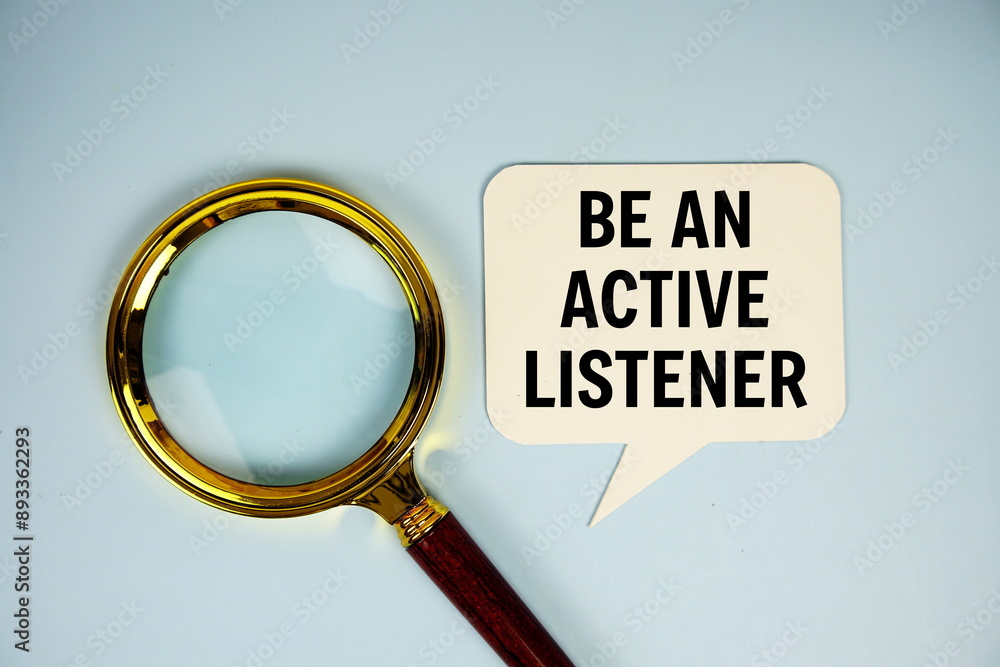 Poster be an active listener text on speech bluble with magnifying glass top view on blue background