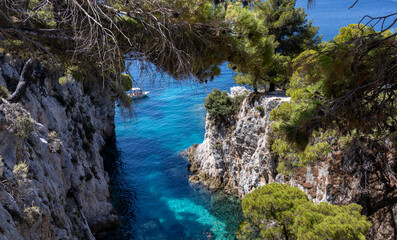 Panoramic view of a serene coastal landscape featuring calm blue waters and distant hills under a clear sky. Peaceful and tranquil scene perfect for relaxation and travel concepts.