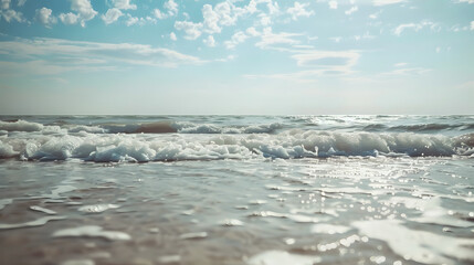 Fototapeta premium Sunny beach landscape with gentle waves. Serene and picturesque coastal view.