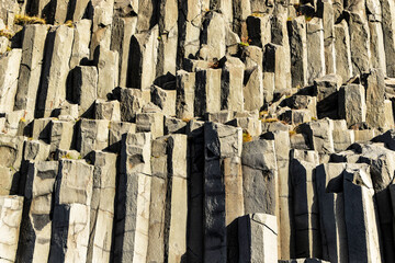 Gardar basalt columns, Iceland. A rocky cliff with many different sized rocks