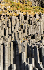 Gardar basalt columns, Iceland. A rocky cliff with many large, jagged rocks