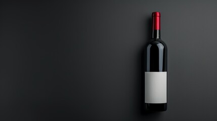 Elegant red wine bottle with blank label on dark background, perfect for branding and advertising purposes in a refined setting.