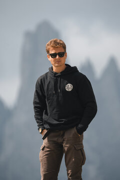 Explorer in the middle of the wild nature. Blue Lake and insano mountains Cover by the coludas. Beautiful landscape