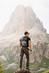 Naklejka premium adventures guys, pirates lost in the mountains with magnificent landscape. Mountains covered in clouds. Explorers having fun