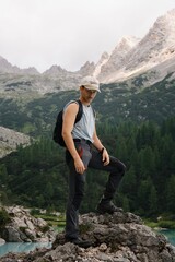 Naklejka premium adventures guys, pirates lost in the mountains with magnificent landscape. Mountains covered in clouds. Explorers having fun