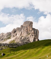 Obraz premium Landscapes of epic mountains during the sunset surrounded by clouds, with warm and cold lights. huge cliffs and epic views from the wild nature. 