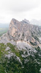 
Landscapes of epic mountains during the sunset surrounded by clouds, with warm and cold lights. huge cliffs and epic views from the wild nature. 