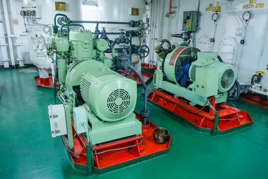 Air compressors inside engine room of cargo ship