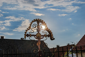Wrought-iron cemetery cross with the Christian motiv in a cemetery, Germany, Puch, 20.7.20245 © were