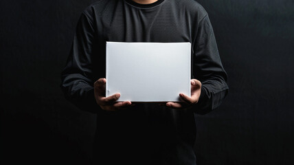 Naklejka premium a man holding a white box delivery. concept online shopping.