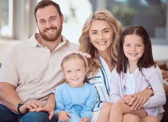 Smile, portrait and family on sofa in home with love, bonding and connection together in Australia. Happy, care and parents hugging girl children on couch in living room for relaxing in house.