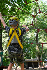 Young adventurer navigating a treetop obstacle course, demonstrating courage and determination
