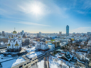 Naklejka premium Winter Yekaterinburg and Temple on Blood in beautiful cloudy sunset. Aerial view of Yekaterinburg, Russia. Translation of the text on the temple: Honest to the Lord is the death of His saints.