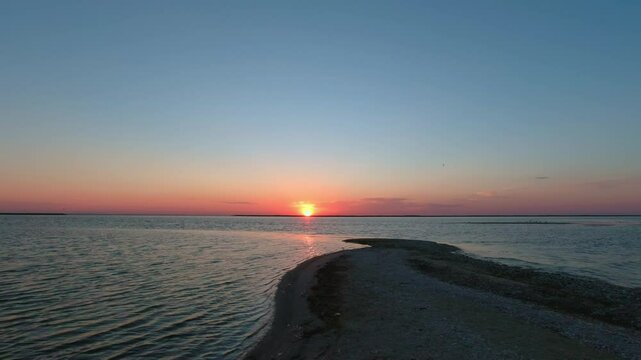 The sun rises over the Kinburn Spit, Ukraine.