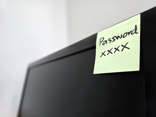 note paper for reminding concept, note paper with password stick on computer monitor to remind...