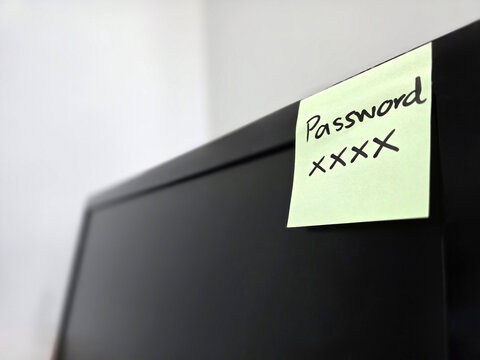 note paper for reminding concept, note paper with password stick on computer monitor to remind password for login