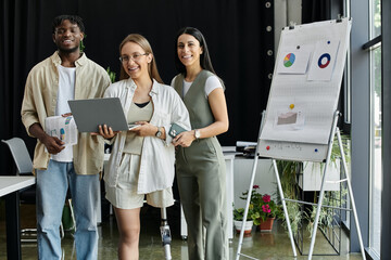 A diverse startup team collaborates in a modern office setting.