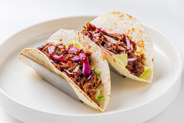 Mexican tacos with pulled pork, avocado, chili peppers