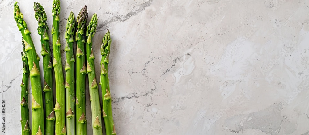 Aufkleber green asparagus positioned on an old fashioned backdrop with room for text in the image. with copy s