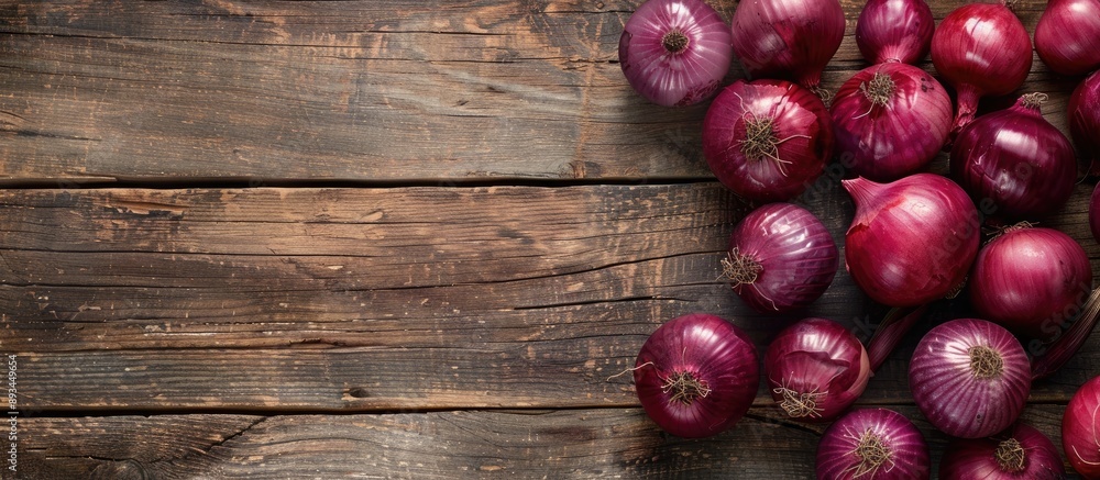 Poster red onions arranged beautifully on a wooden surface providing ample copy space image for your conten