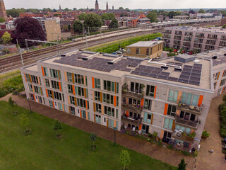 Obraz premium Exterior facade aerial of Ubuntuplein residential housing at the Ettegerpark during sunrise with Ettegerpark in the foreground. Dutch engineering real estate investment urban development