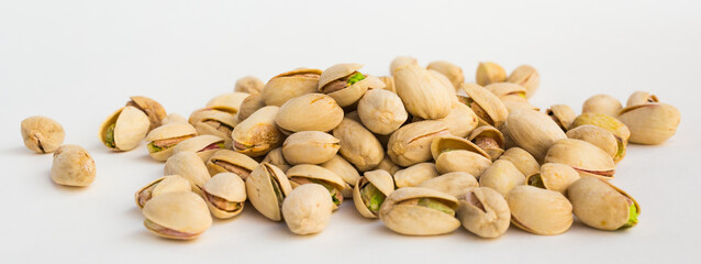 Roasted pistachios on white background
