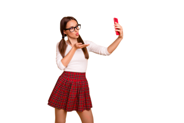 Portrait of nice-looking attractive lovely lovable tender winsome girl holding in hand camera making taking selfie video message isolated on bright vivid shine yellow background