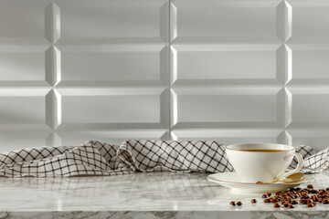 White cup of coffee on white marble table with white tiled wall with sunlight background and copy space for products. Image for montage objects display. 