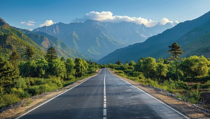Naklejka premium Asphalt Road Through Majestic Mountains