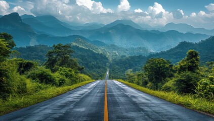 Fototapeta premium Asphalt Road Winding Through Lush Green Mountains