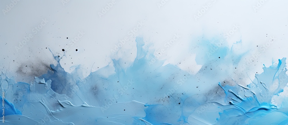 Fototapete close-up image of light blue paint splatter on a gray background with copy space image.