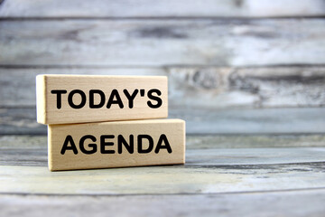 today's agenda Short word english letter or text on wood block with gray background.Copy space...
