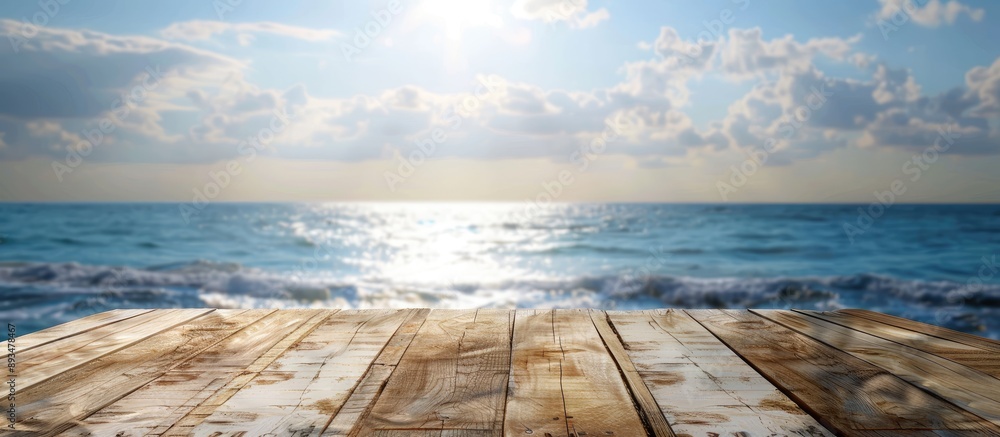 Aufkleber Outdoor scenery featuring an empty wooden table with a spring sky blue sea and blurred bokeh effect ideal for counter display concepts with copy space image