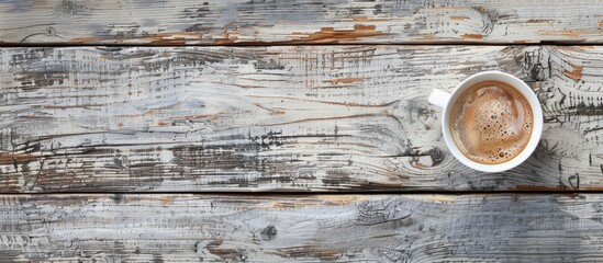 Coffee in a cup on a grey wooden surface with space for additional images