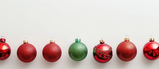 Isolated on a white background Christmas toys red and green balls gifts create a festive display with copy space image