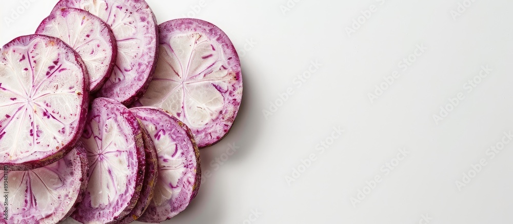 Poster Taro slices displayed on a clear white background with copy space image