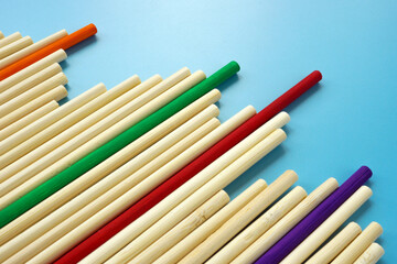 Obraz premium Abstract wooden sticks and colored ones as a concept of success and difference.