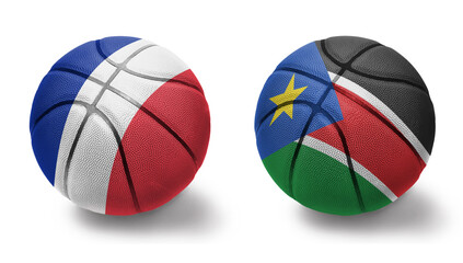 basketball balls with the national flags of south sudan and france on the white background.