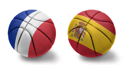 basketball balls with the national flags of spain and france on the white background.