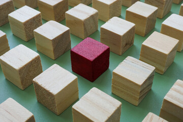 Abstract structure of cubes and one red one. Leadership or talent search.