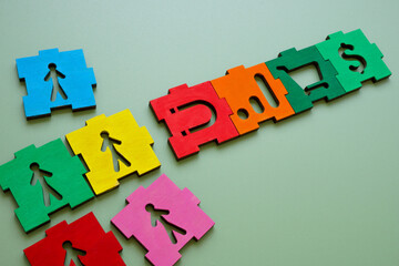 Diversity marketing and customer acquisition. Close-up of colorful puzzle pieces with magnet.