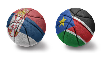 basketball balls with the national flags of serbia and south sudan on the white background.