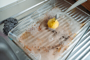 Minimalist kitchen cleaning scene with lemon. Natural cleaning, household maintenance. Concept of...