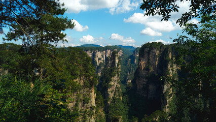 Fototapeta premium Zhangjiajie national forest park, China, Glass bridge of Zhangjiajie China Tianzishan with blue sky, concept of world heritage, avatar, heritage peak or cliff mountain, tourist attraction famous place