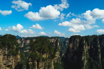 Zhangjiajie national forest park, China, Glass bridge of Zhangjiajie China Tianzishan with blue sky, concept of world heritage, avatar, heritage peak or cliff mountain, tourist attraction famous place