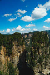 Zhangjiajie national forest park, China, Glass bridge of Zhangjiajie China Tianzishan with blue sky, concept of world heritage, avatar, heritage peak or cliff mountain, tourist attraction famous place