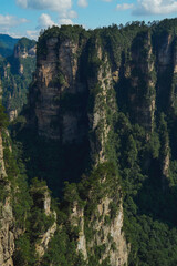 Fototapeta premium Zhangjiajie national forest park, China, Glass bridge of Zhangjiajie China Tianzishan with blue sky, concept of world heritage, avatar, heritage peak or cliff mountain, tourist attraction famous place